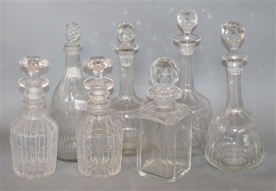 A collection of seven cut glass decanters